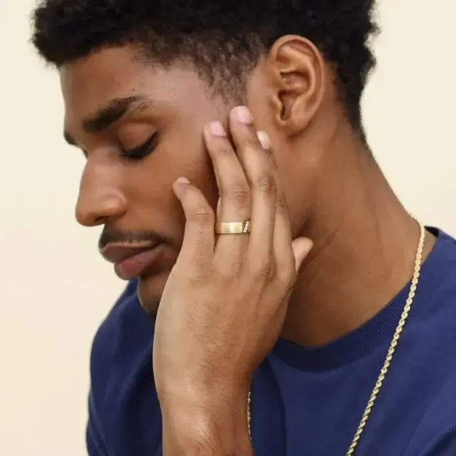 male model wearing 6.5mm wedding band with 3 diamonds