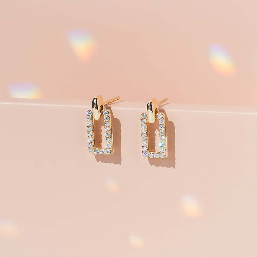 beautiful rectangle earrings on a unique background