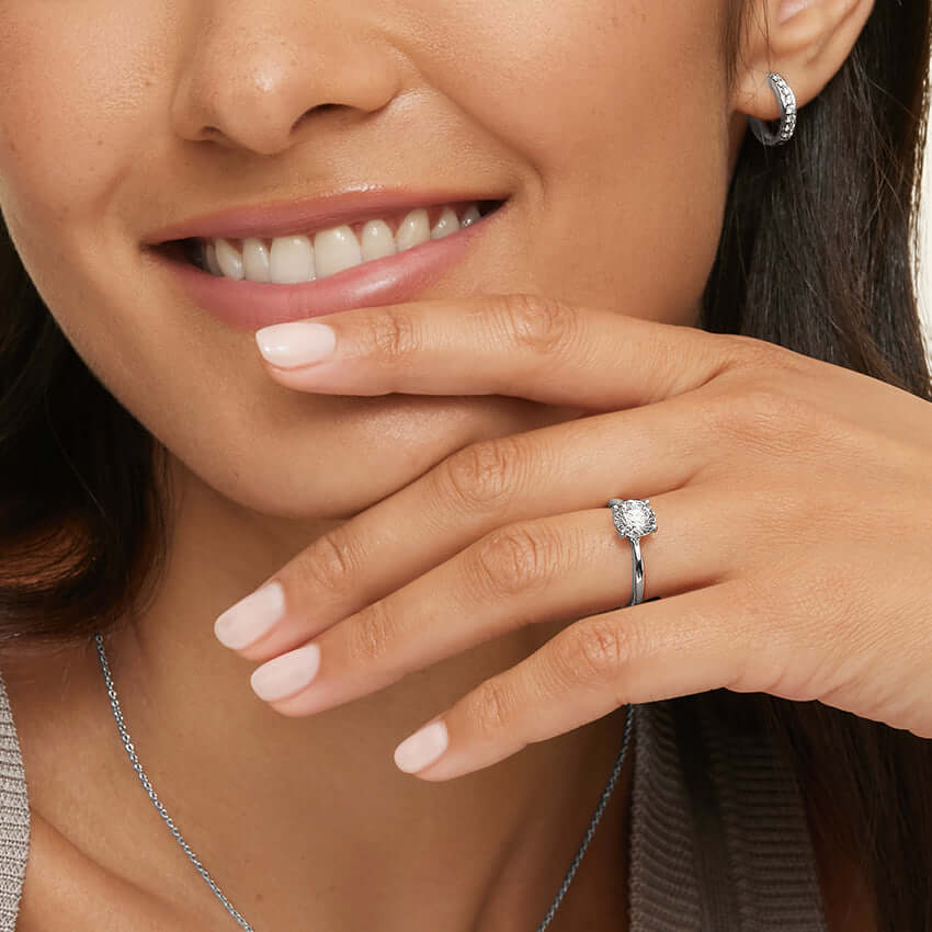 female model wearing Debra Solitaire Engagement Ring