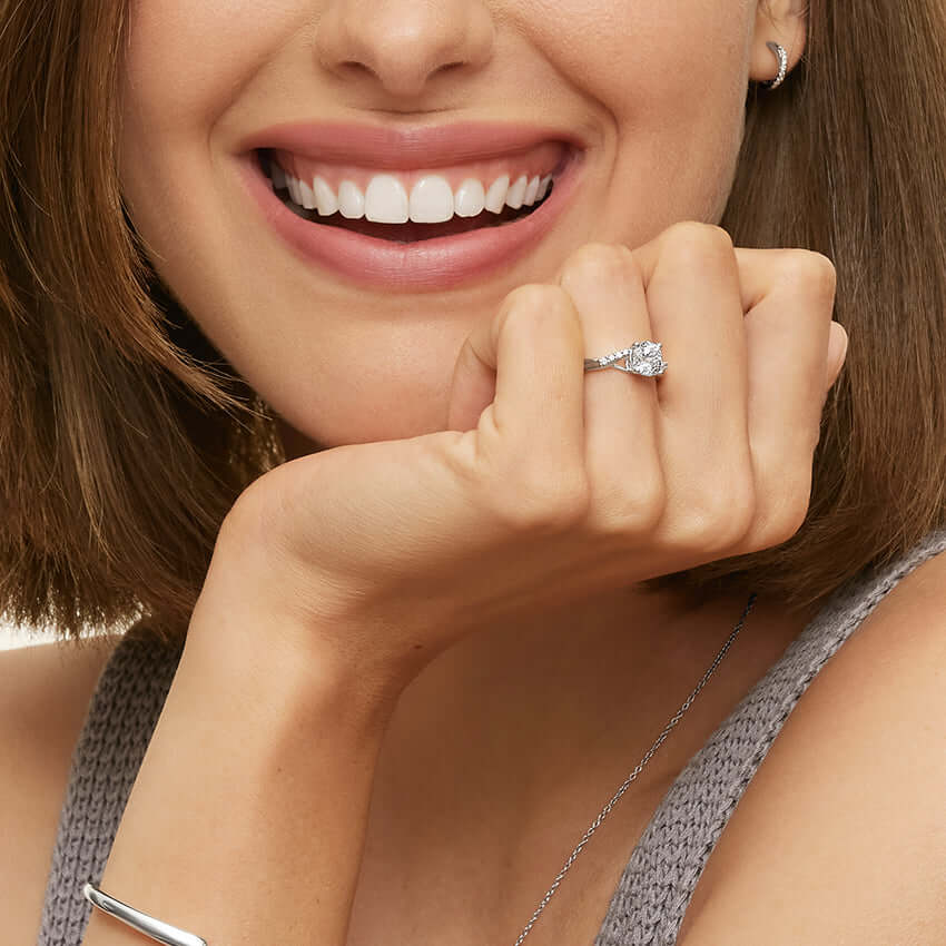 2nd model wearing degrade set diamonds emerald cut lab diamond engagement ring white face