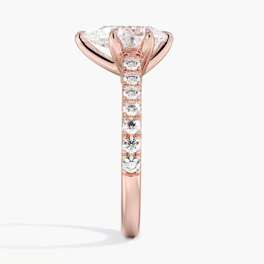 engagement ring 14k rose gold pear shaped diamond with side set diamonds side view