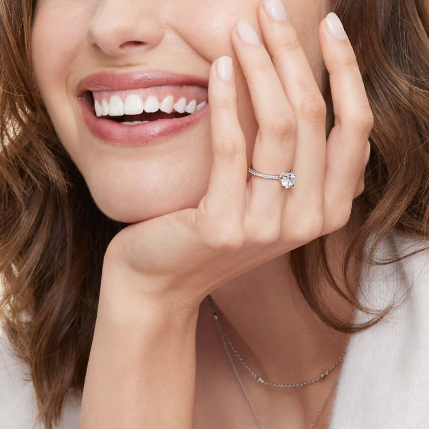 2nd model wearing round lab diamond claw prong engagement ring