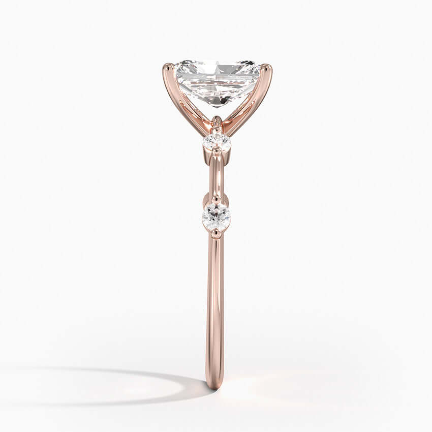 radiant cut lab diamond engagement ring with 2 diamonds on each side rose side