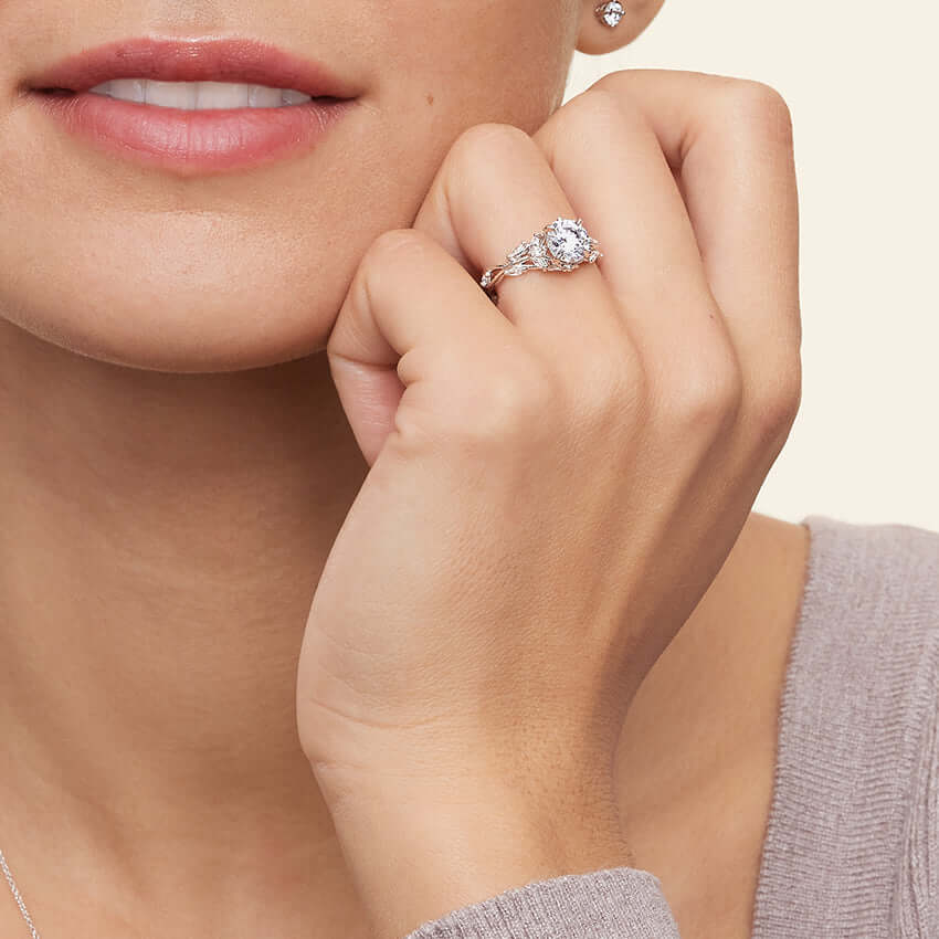 3rd model wearing nature inspired asscher cut lab diamond engagement ring with marquise diamonds