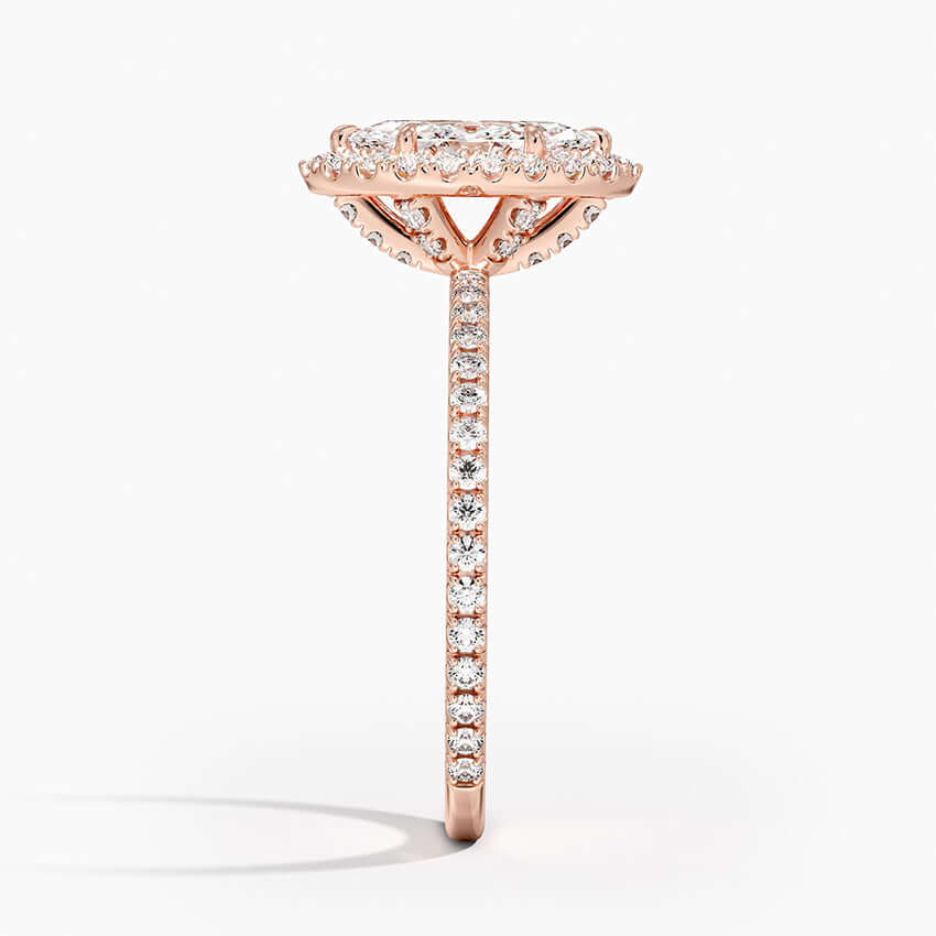 Halo marquise engagement ring claw prong rose gold side view