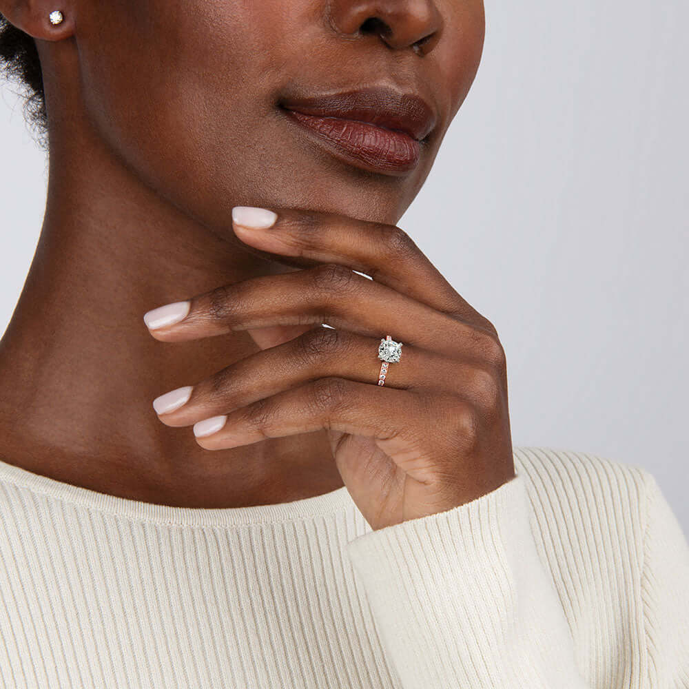 model wearing princess cut solitaire ring with white gold head