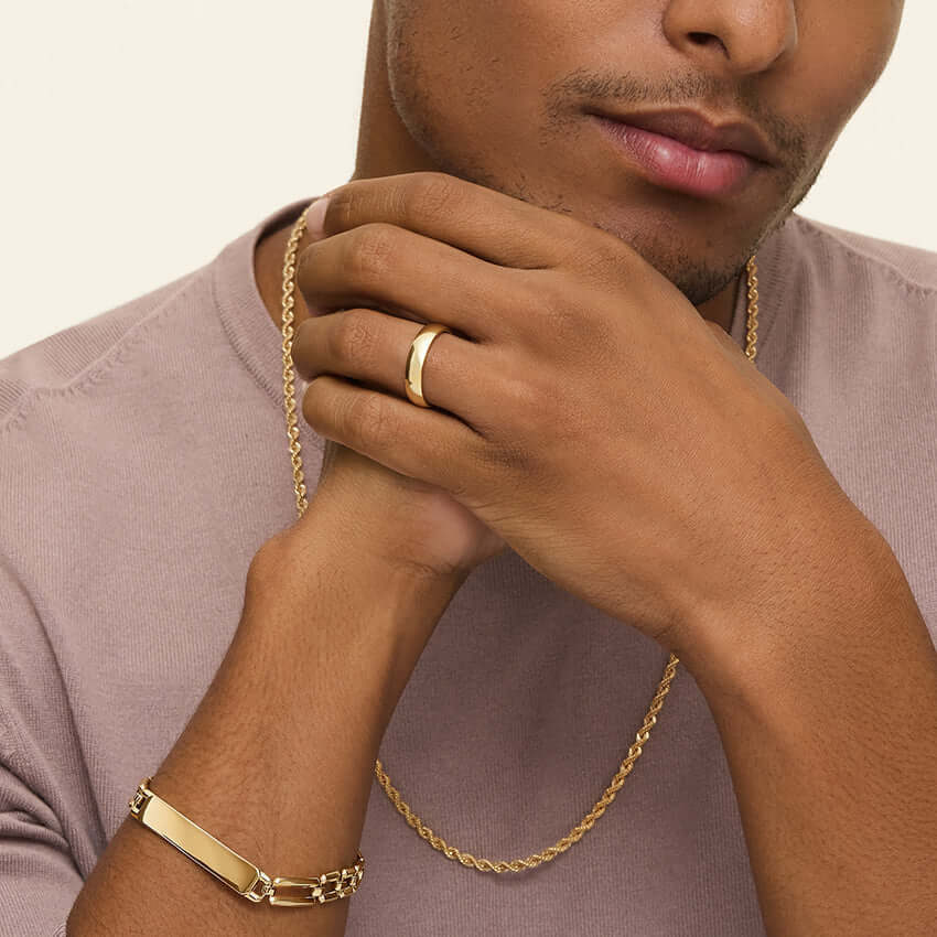 male mode wearing 14k yellow gold wedding band