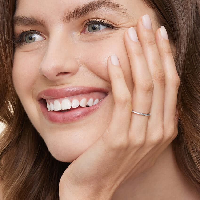 2nd model wearing diamond set wedding band