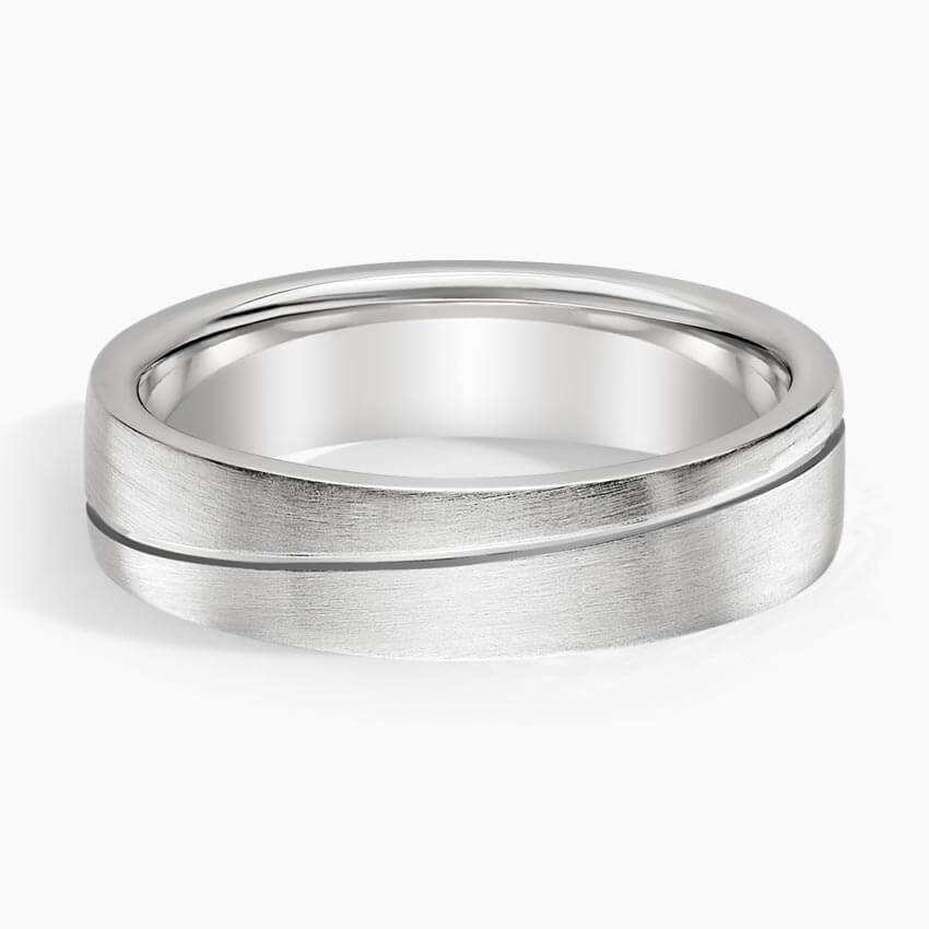 wedding band with an engraved line going across it white face