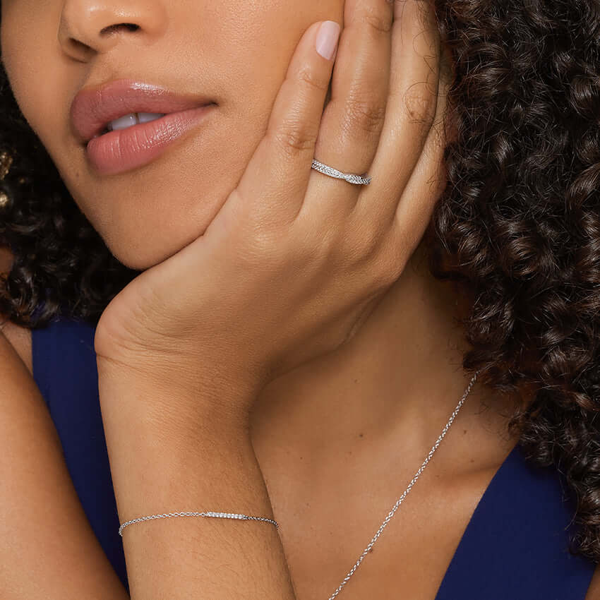 2nd model wearing entwined diamond set wedding ring