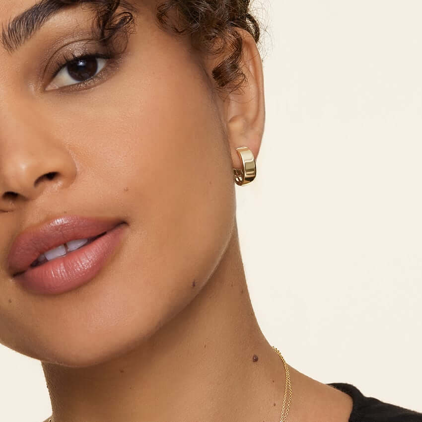 2nd female model wearing Edith Wide Hoop Earrings