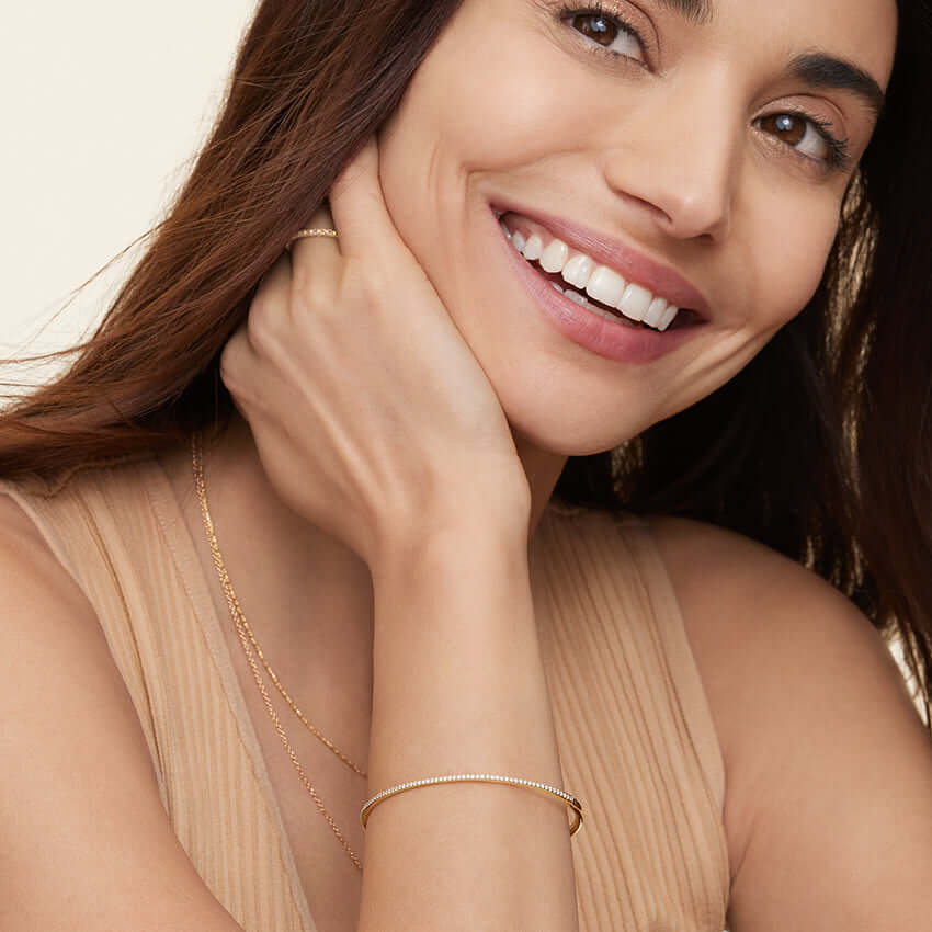 6th model wearing yellow gold Zoey Diamond Bangle Bracelet