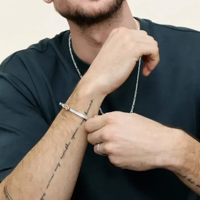 male model wearing white bangle with yellow lock