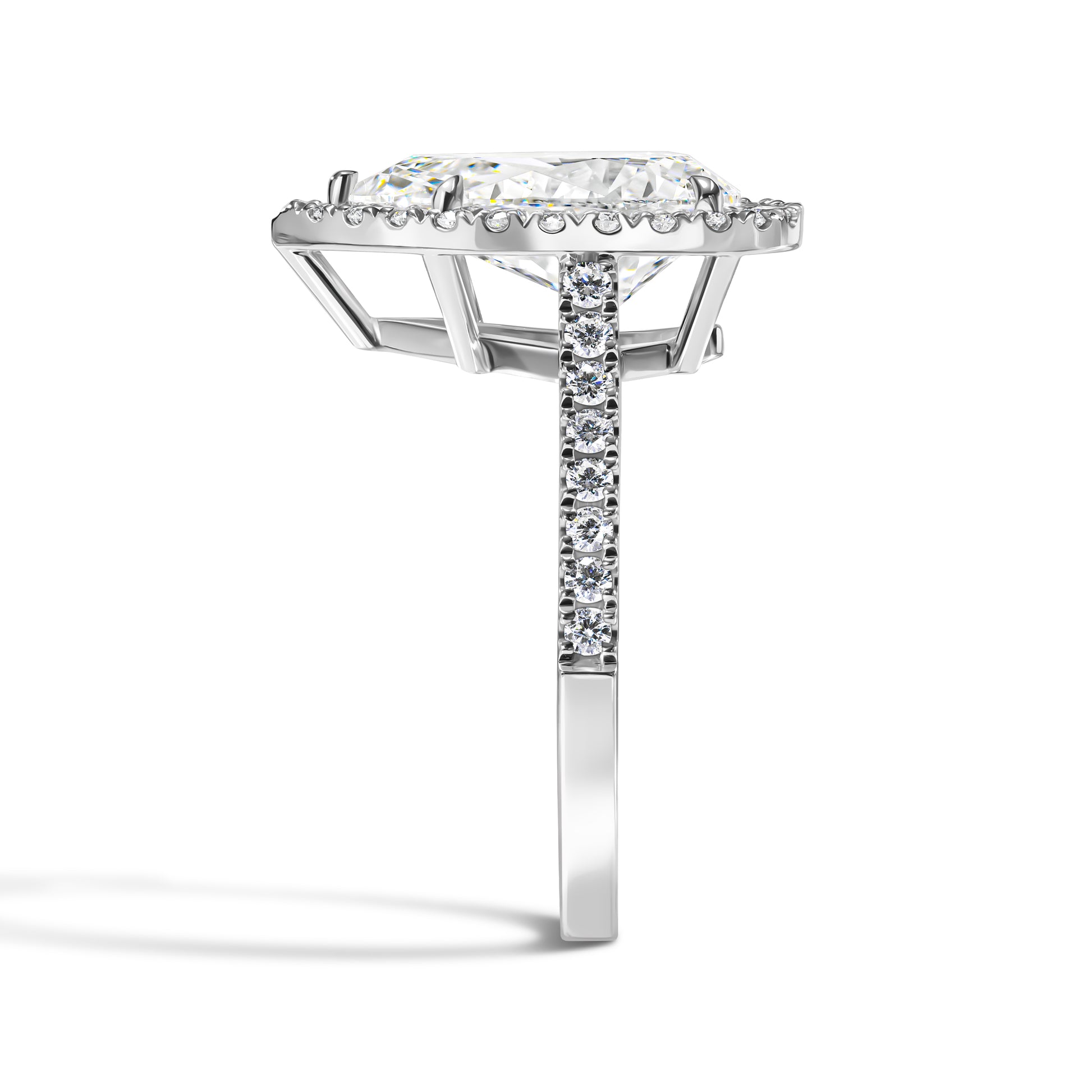 Diamond ring with a rectangular stone and smaller diamonds on the band against a white background
