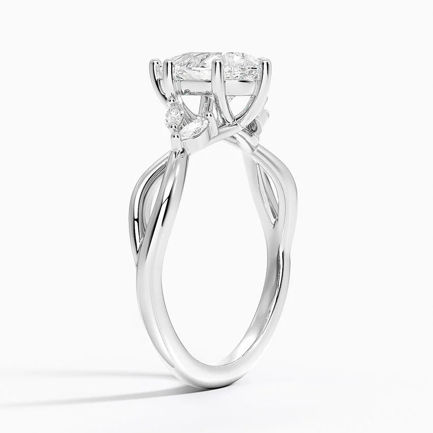 pear cut diamond engagement ring with marquise cut smaller diamonds white