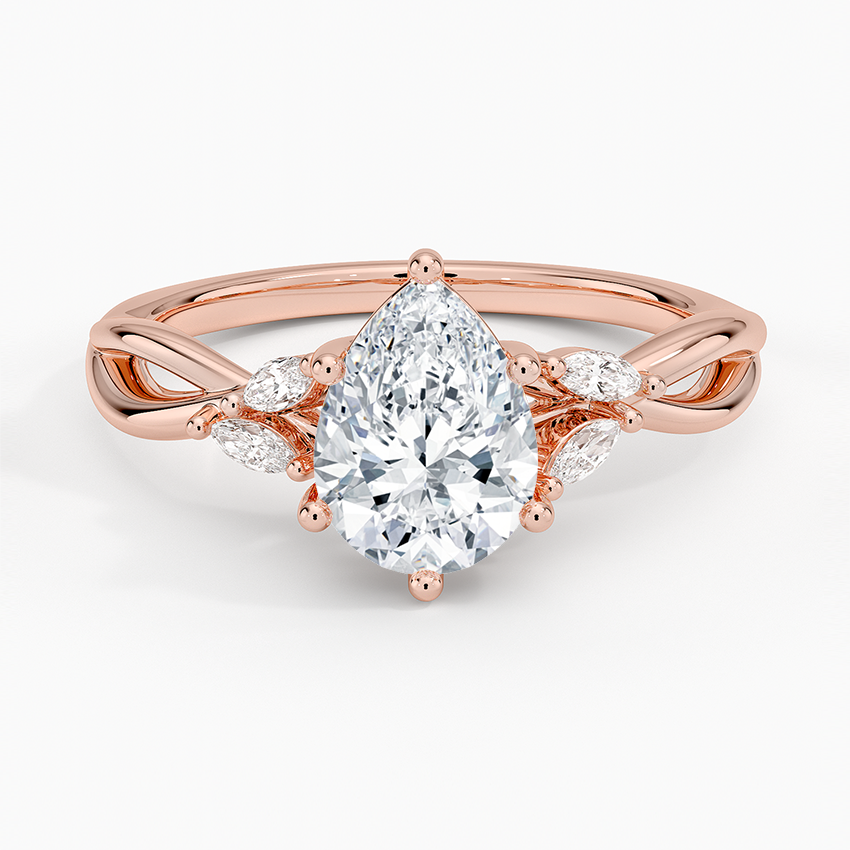 pear cut diamond engagement ring with marquise cut smaller diamonds rose face