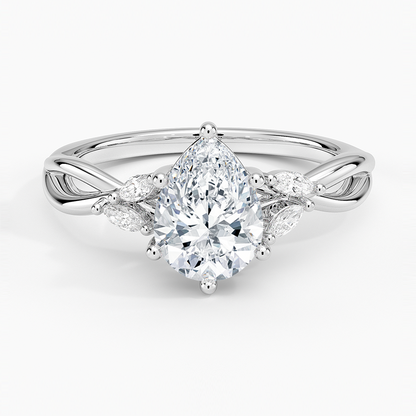 pear cut diamond engagement ring with marquise cut smaller diamonds white face