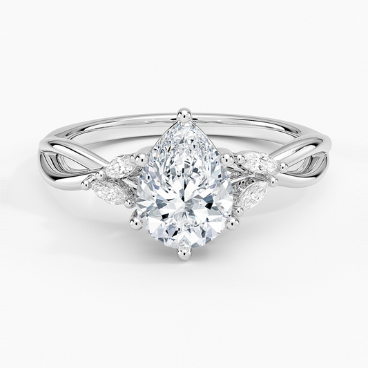 pear cut diamond engagement ring with marquise cut smaller diamonds white face