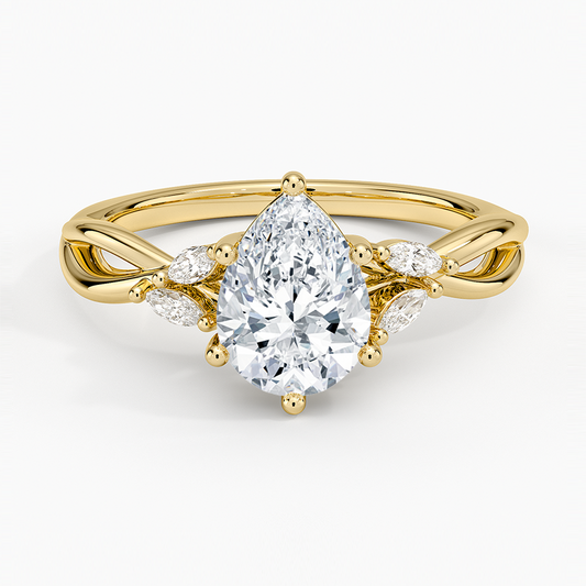 pear cut diamond engagement ring with marquise cut smaller diamonds yellow face