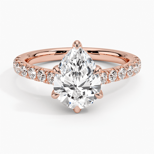 engagement ring 14k rose gold pear shaped diamond with side set diamonds face view