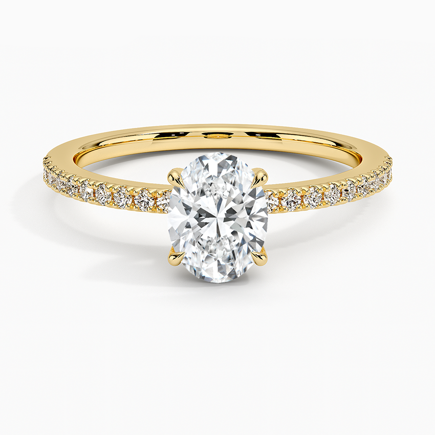 Claw prongs oval lab diamond engagement ring with pave settings and hidden halo yellow face