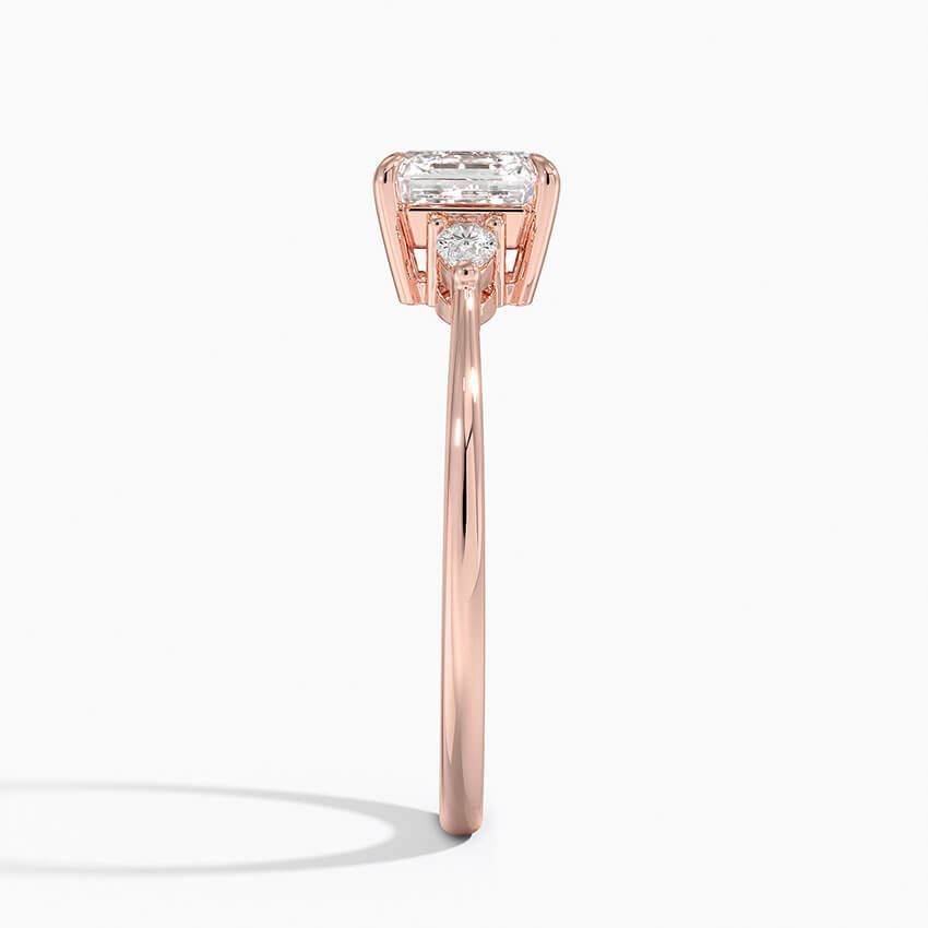 asscher cut diamond three stone engagement ring claw prongs rose gold side view