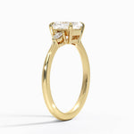 asscher cut diamond three stone engagement ring claw prongs yellow gold