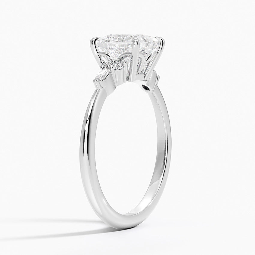 round and marquise side diamonds set on a claw prong engagement ring white