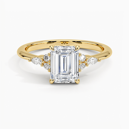 engagement ring emerald cut diamond with marquise and round diamonds on the side 14k yellow gold face view