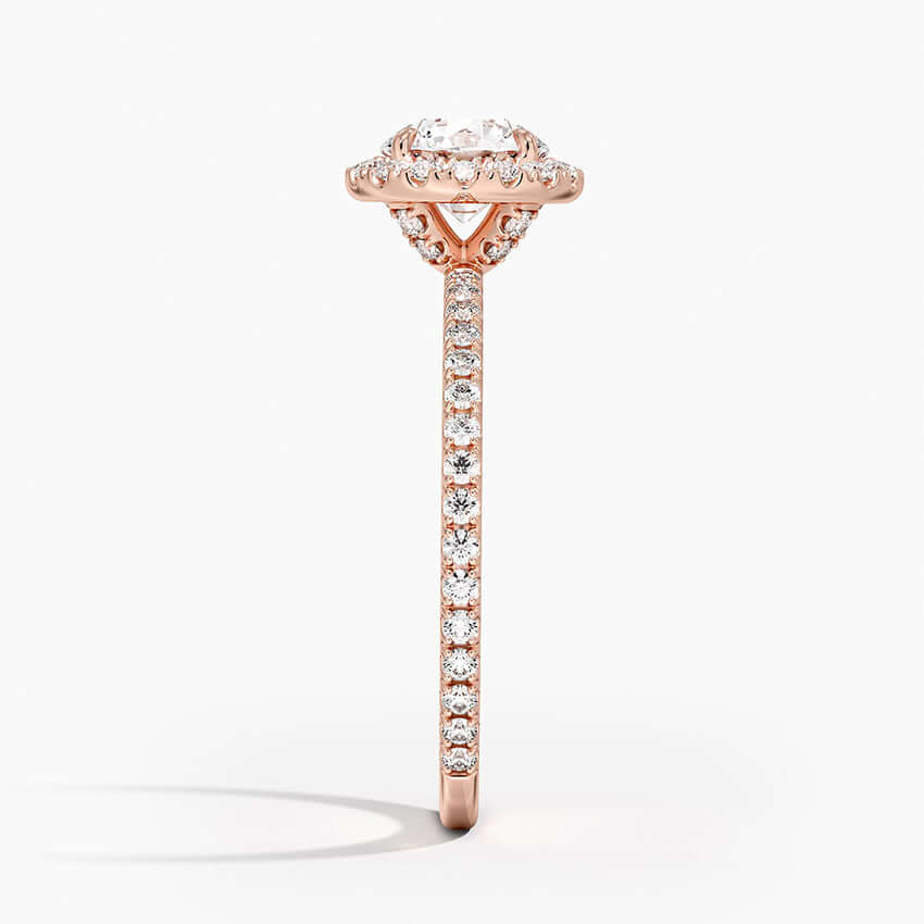 Round diamond halo engagement ring with diamond set bridge rose gold side view