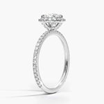 Round diamond halo engagement ring with diamond set bridge white gold