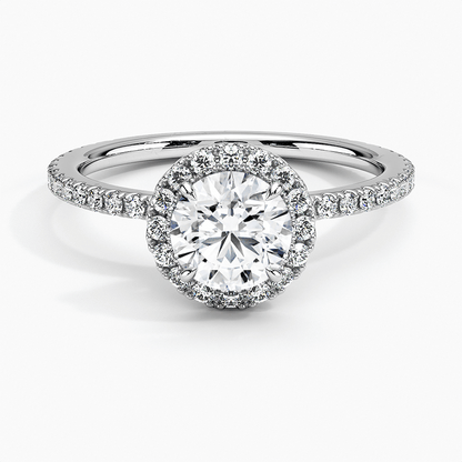 Round diamond halo engagement ring with diamond set bridge white gold face view