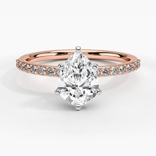 6 prong white gold with rose gold engagement ring pear diamond and round setting face view