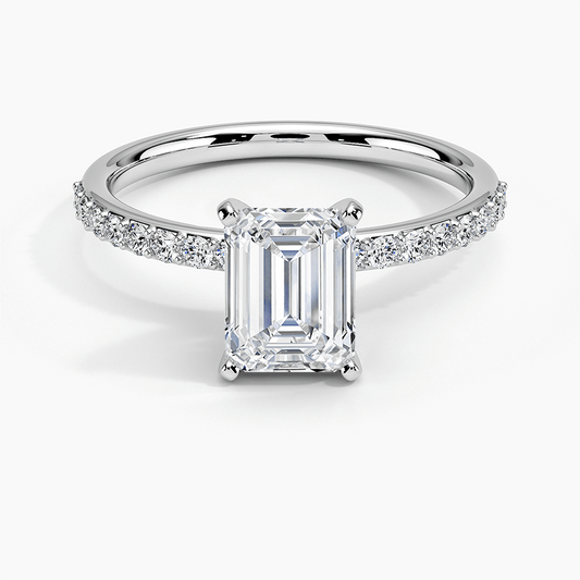 white gold engagement ring with white gold head emerald cut diamond and round diamonds on the sides face view