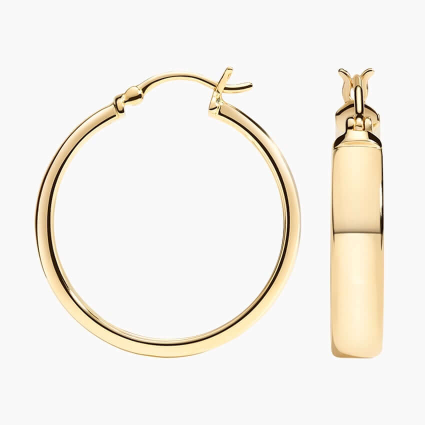 side view of golden hoop earrings