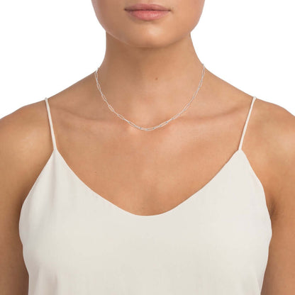 model wearing white gold paperclip neckalce