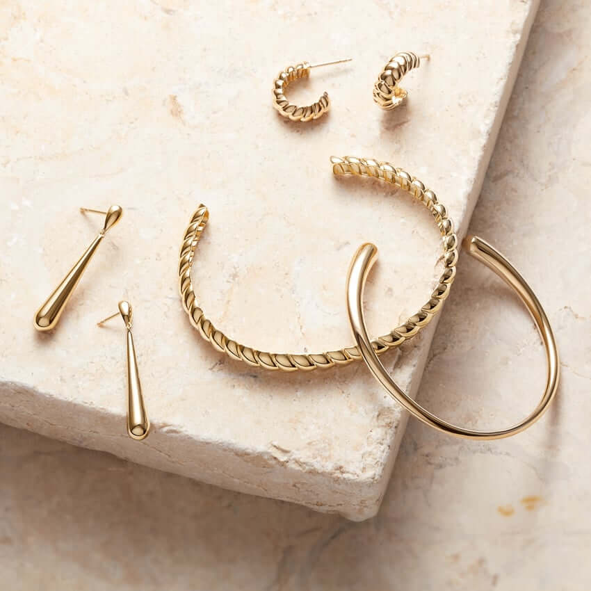 a collection of gold jewelery 