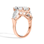 Rose gold ring with diamond accents on a white background