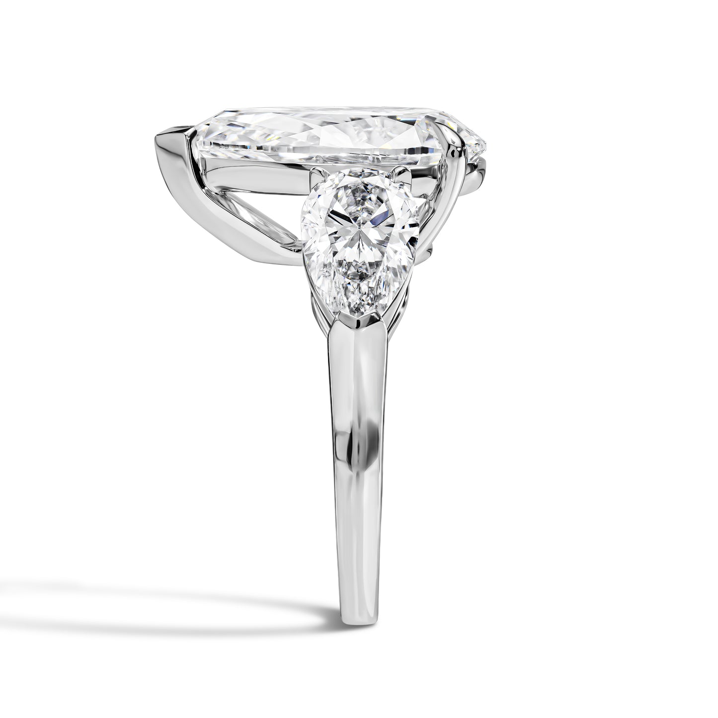 Diamond ring with a pear cut stone on a white background