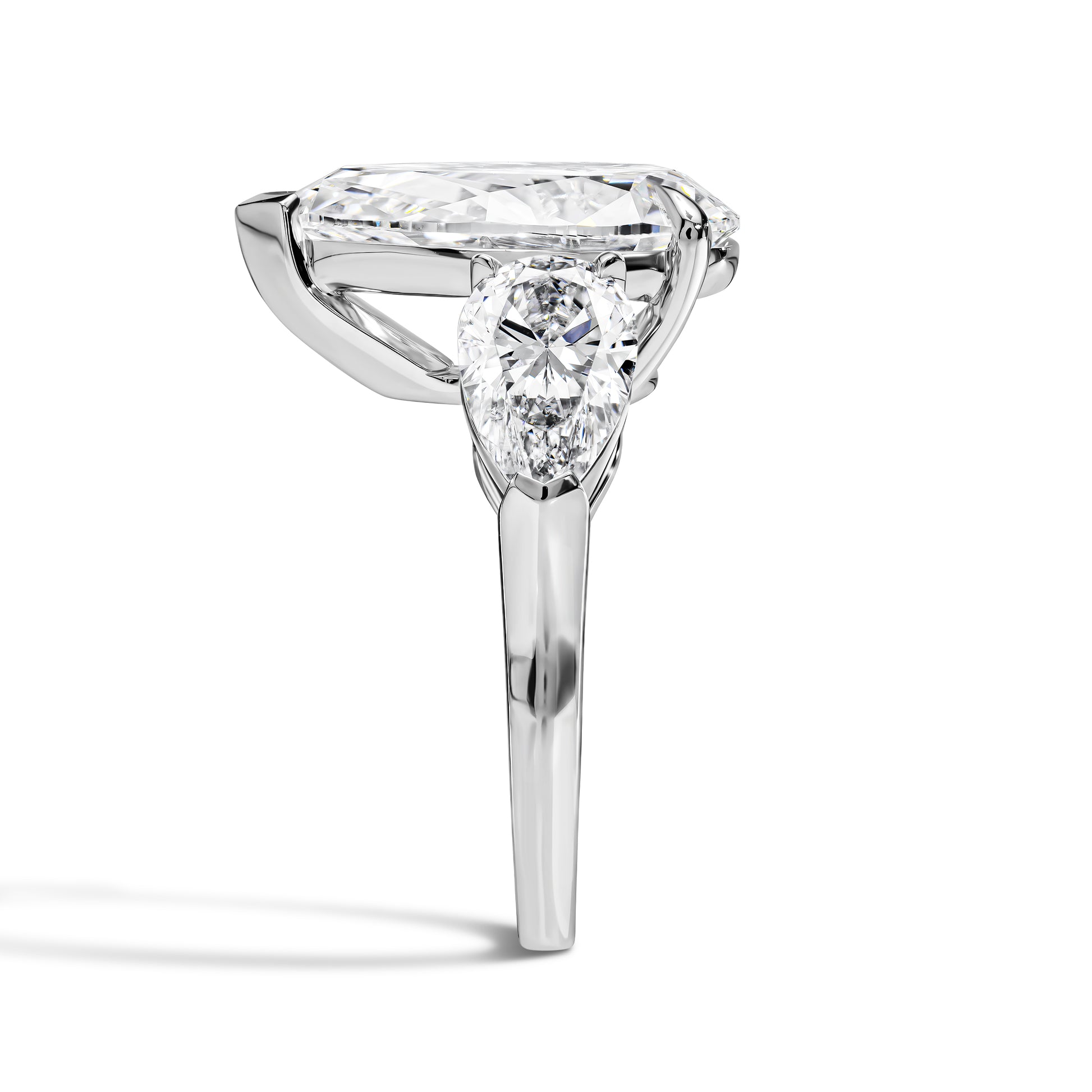 Diamond ring with a pear cut stone on a white background