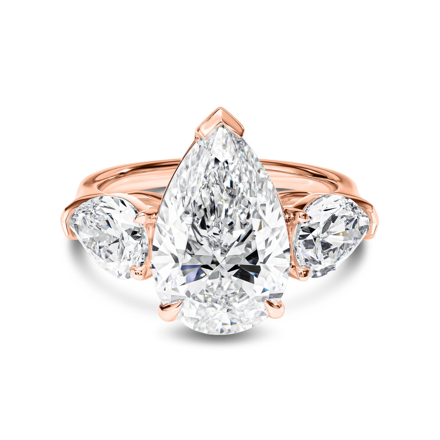 Rose gold ring with pear-shaped diamond on a white background