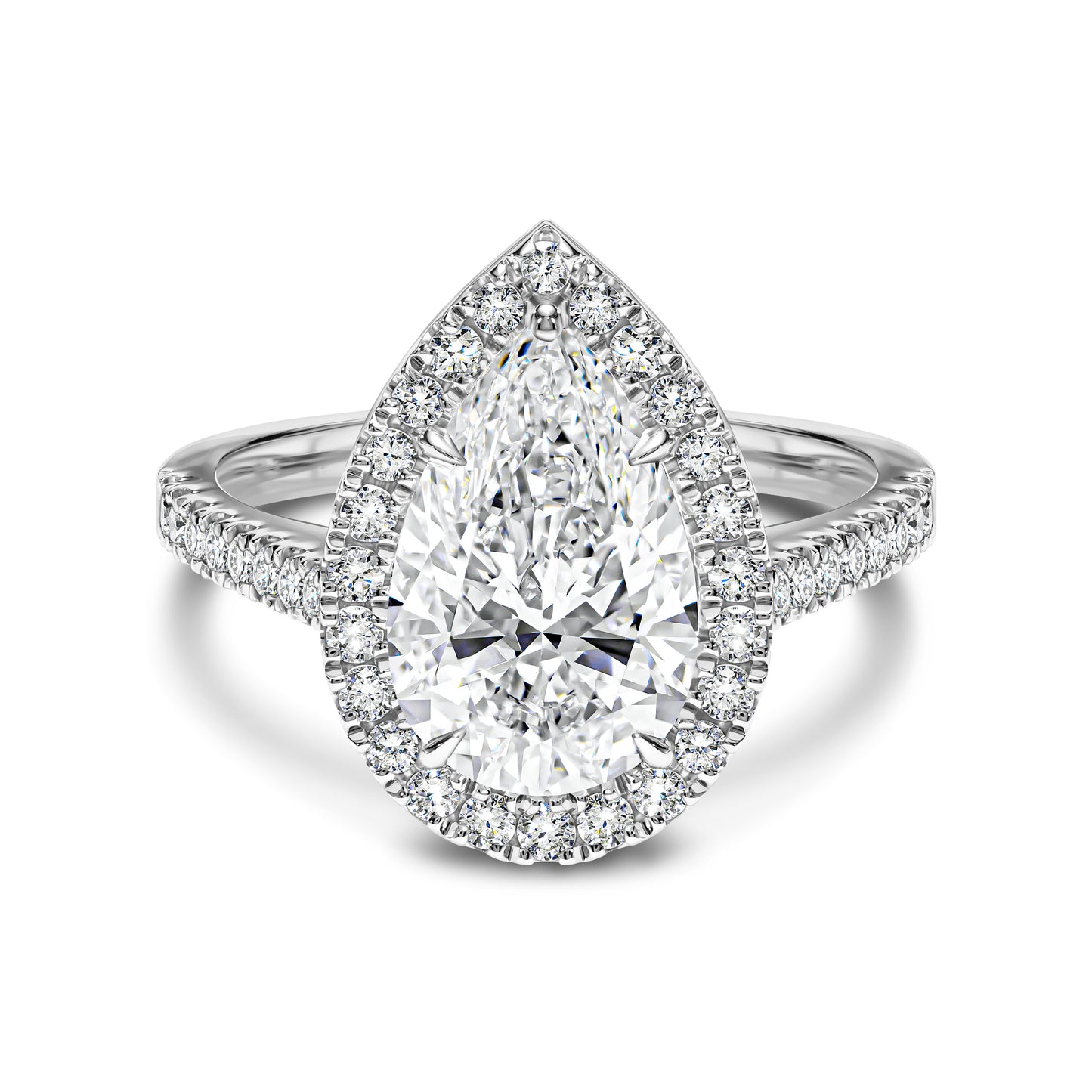 Diamond ring with pear-shaped center stone and halo on a white background