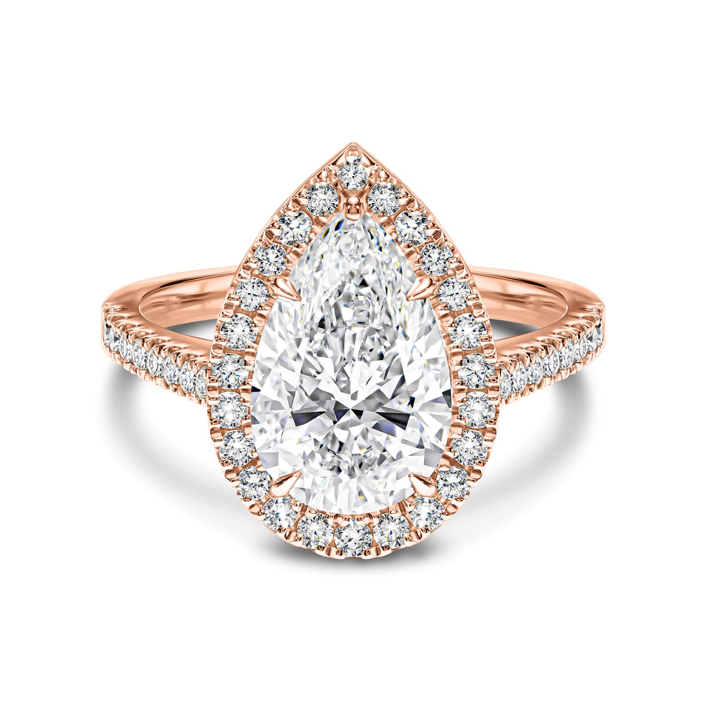 Rose gold ring with a pear-shaped diamond and halo on a white background